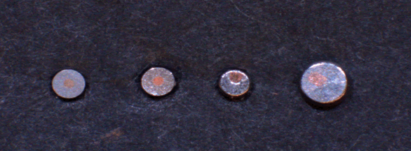 Figure 5: A comparative view of four different finishes on bi-metal, copper-cored pin surfaces (from left to right: A, B, C, and D).