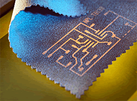 Printing conductive circuits directly on conventional fabrics